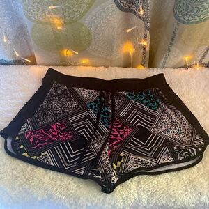 Neon print cotton shorts with tie front & stretch material. Size L (11/13).